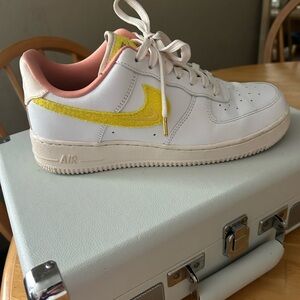 Nike Low Air Force Ones in pink, yellow and white. Women’s size 8.5, minimal use